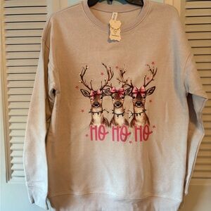 NWT reindeer sweatshirt in pretty colors. Fleece lined.